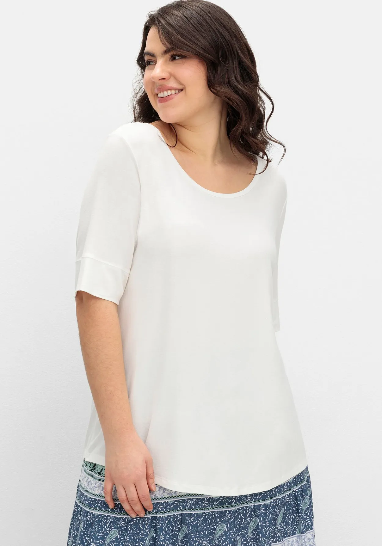 Jerseyshirt mit abgerundetem Saum<sheego Sale