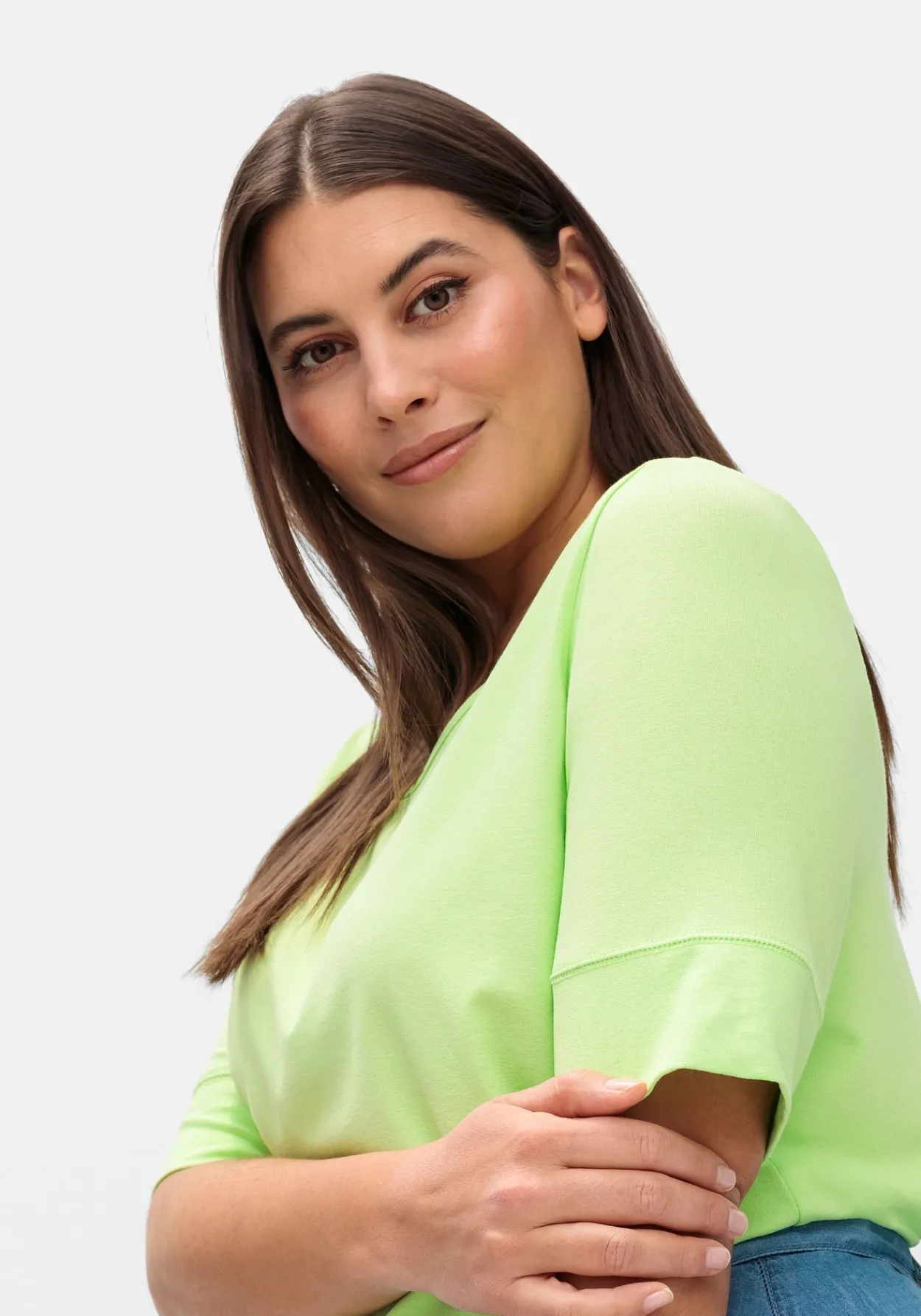 Jerseyshirt mit abgerundetem Saum<sheego Fashion