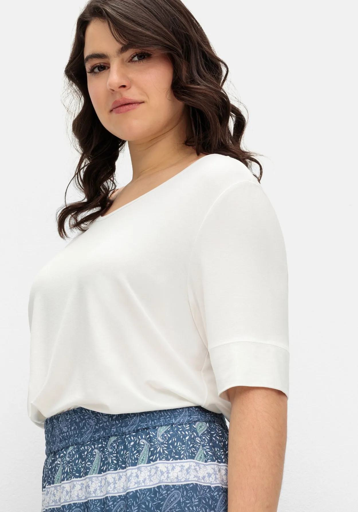 Jerseyshirt mit abgerundetem Saum<sheego Sale