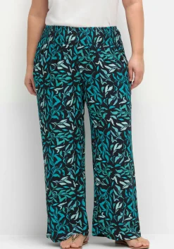 Weite Schlupfhose mit Smokbund und Blätterprint<sheego Hot